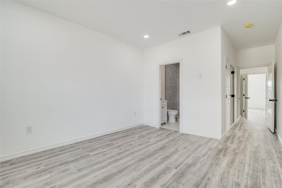 Spare room featuring light wood-type flooring