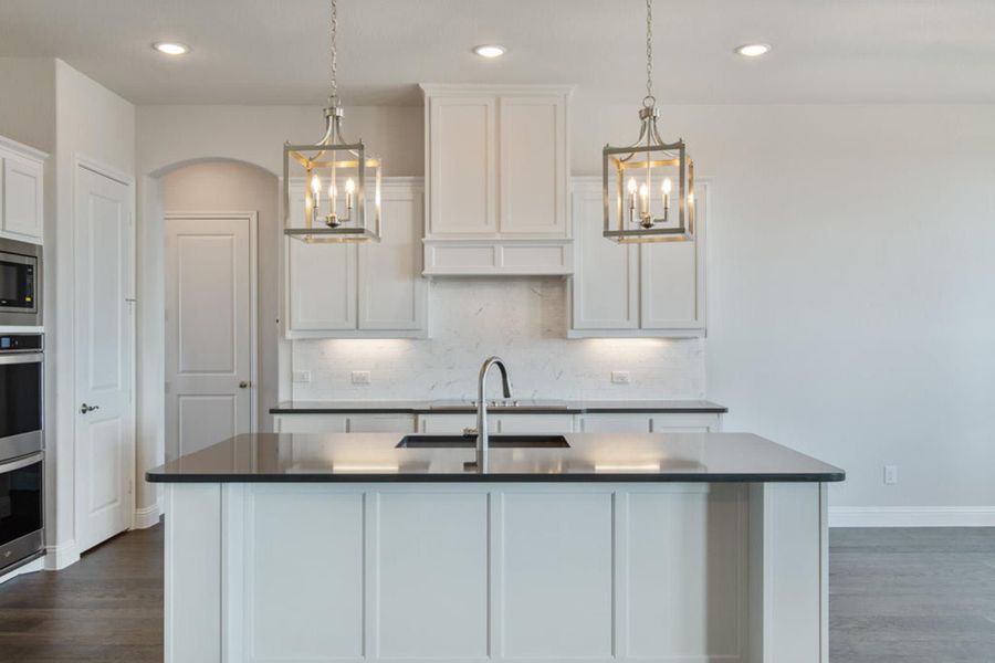 Kitchen | Concept 2406 at Hidden Creek Estates in Van Alstyne, TX by Landsea Homes