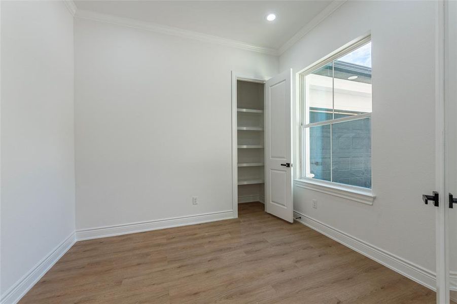 The closet in study has built in shelves to help keep things a little more organized!