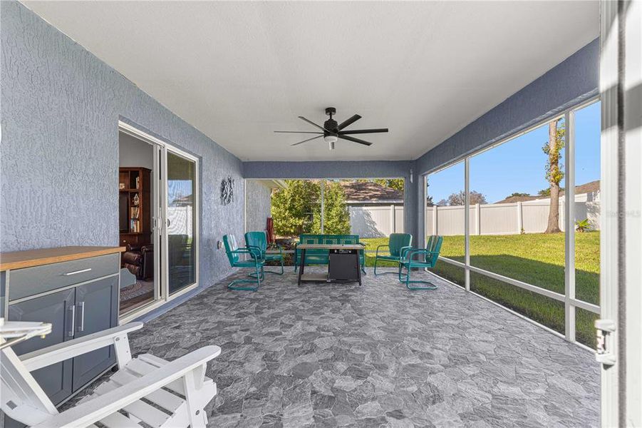 Large screened in patio with stone stamp