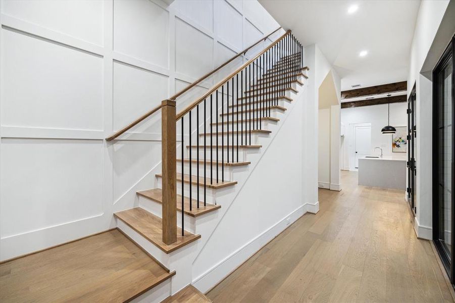 Incredible Trim work on the wall and up the staircase. The staircase also has oak treads on all stairs, transitional iron balusters, wood handrails and newel posts.