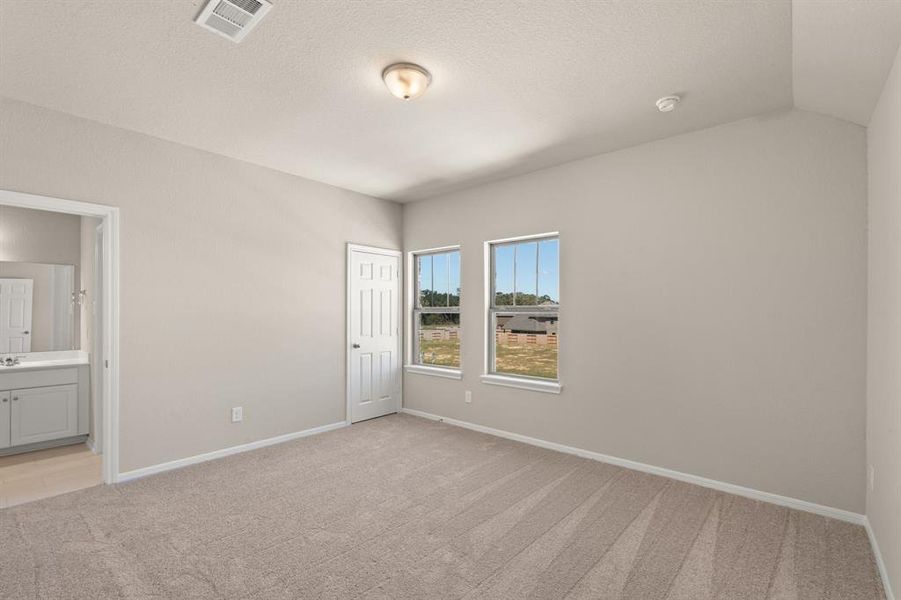 Your secondary bedroom features plush carpet, fresh paint, closet, and a large window that lets in plenty of natural lighting.