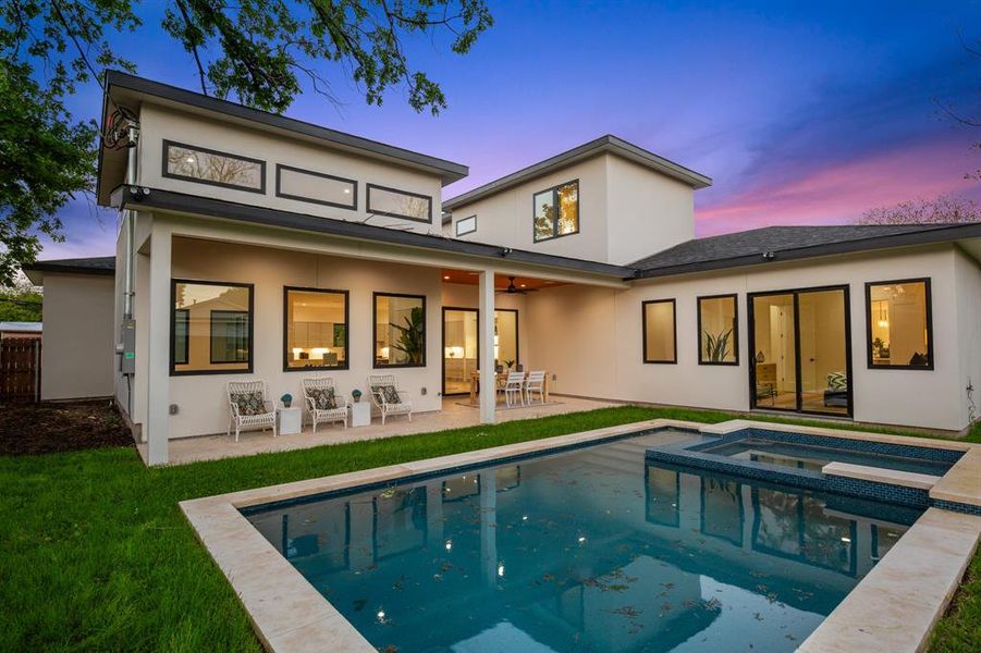 Dive into luxury with this captivating in-ground pool and beautifully landscaped backyard.