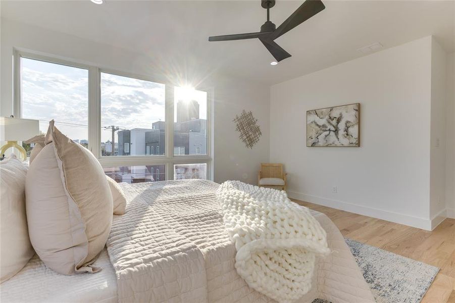 Bedroom featuring light hardwood / wood-style floors and ceiling fan