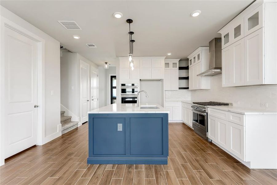 Two-toned cabinetry and open shelving!