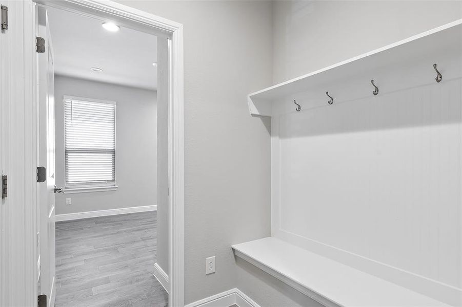 Mudroom featuring light wood-type flooring