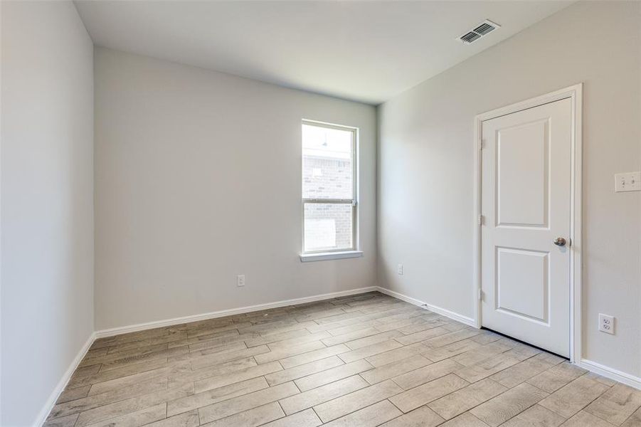 Spare room featuring light hardwood / wood-style floors