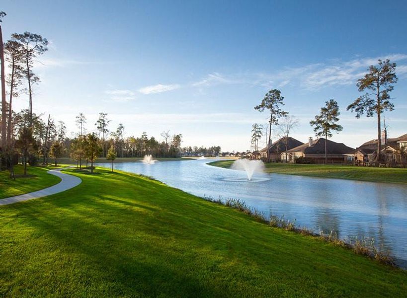 Discover the serene beauty of a picturesque community lake, complete with elegant fountains that create a tranquil ambiance.