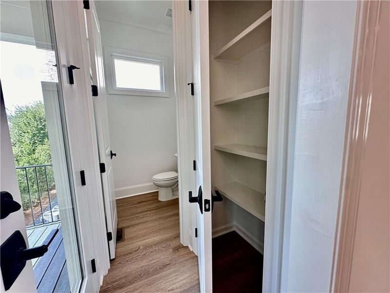 Enjoy additional storage with a pantry right off the powder room and rear deck access