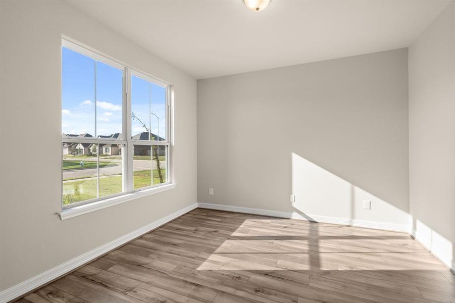 The home office features French doors, beautiful floors, large windows that give a fresh feel, this space promotes focus and creativity.