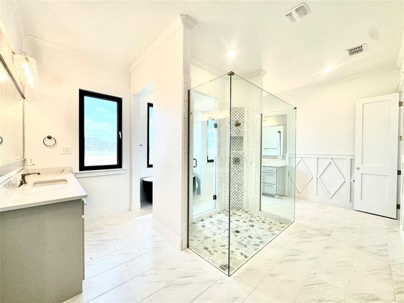 Bathroom featuring tile patterned flooring, ornamental molding, vanity, and a shower with shower door