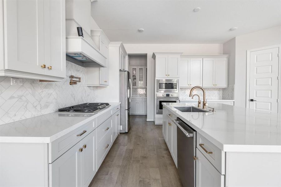 The kitchen has a sleek design, keeping the kitchen simple and classy it offers a great canvas for the next owner to add their personal touch on this luxury home.