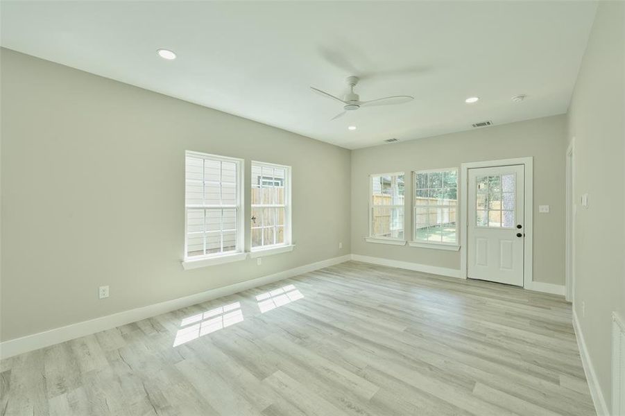 Beautiful Luxury vinyl floors complimented by Agreeable Gray on the walls