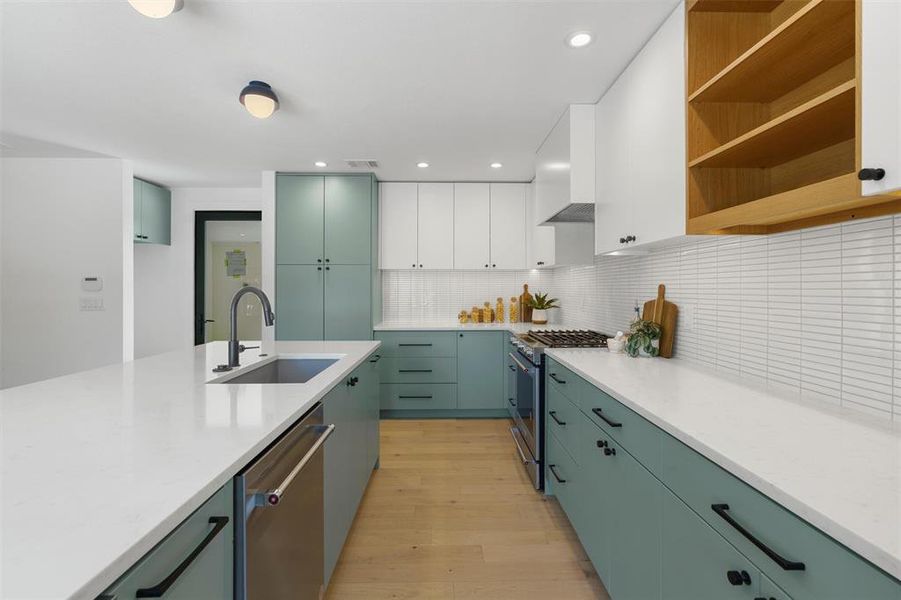 The kitchen offers plenty of counter space as well as an exit to the super-convenient mud room area adjoining the covered carport.