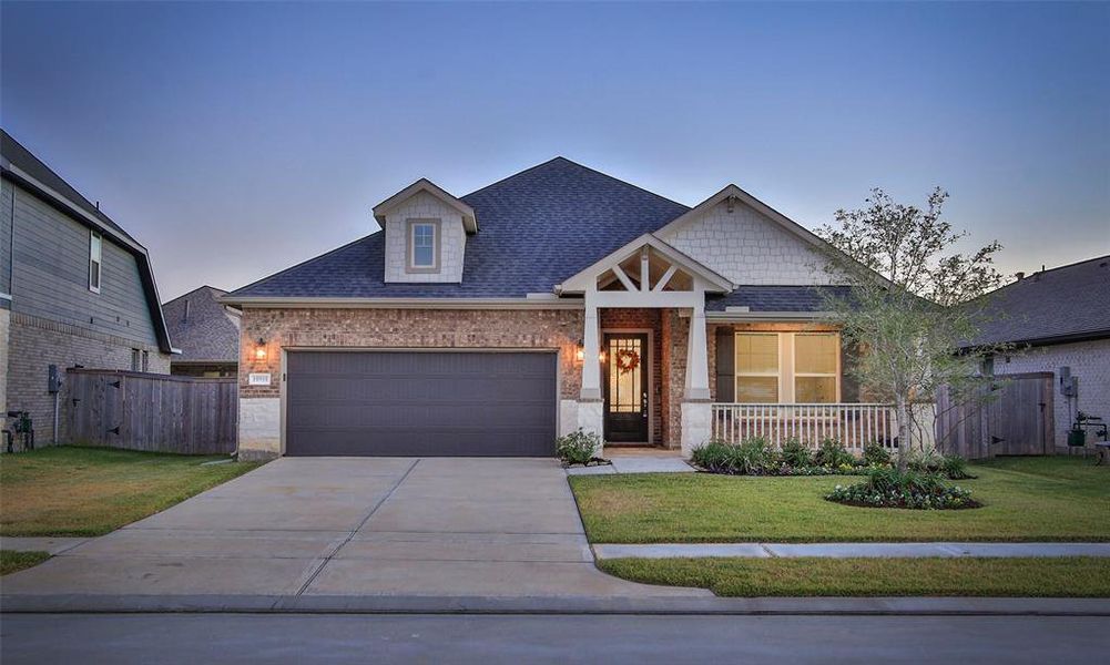 Discover your private oasis with a pristine swimming pool, shaded patio for alfresco relaxation, and a beautifully manicured lawn, all enclosed by a privacy fence for your tranquil outdoor retreat.