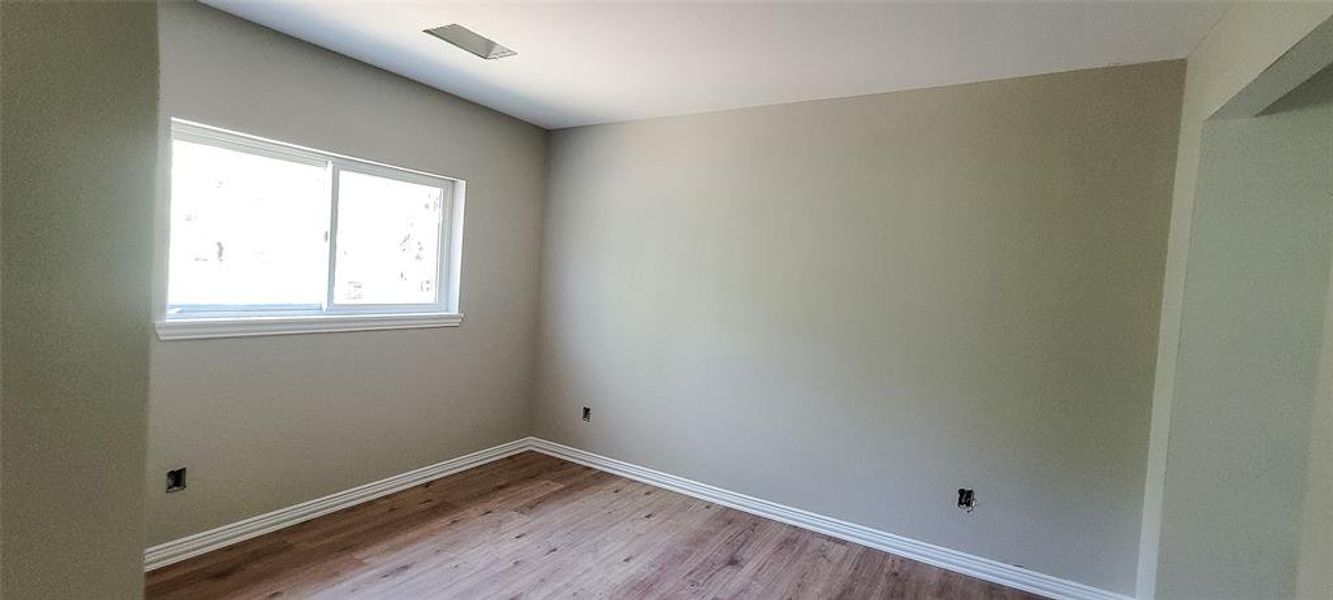 Unfurnished room featuring light hardwood / wood-style floors