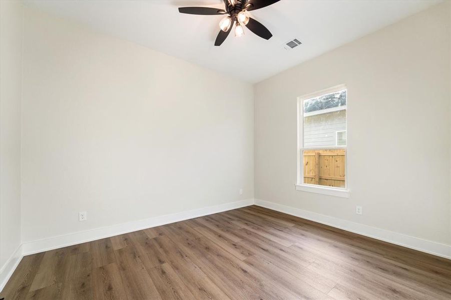 Bedroom 3, no carpet in this whole house! Low maintenance and easy cleaning.