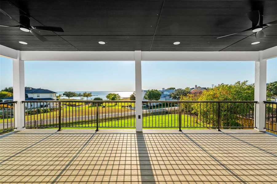 View of patio / terrace with ceiling fan and a balcony