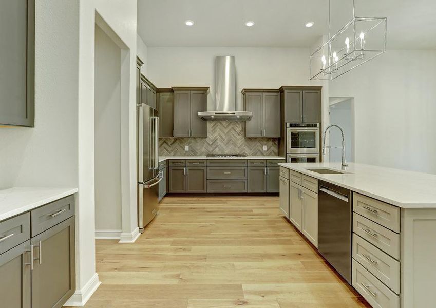 The chef-ready kitchen has stainless steel appliances and stunning wood cabinetry.