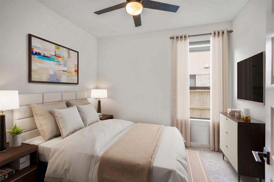 Tucked away on the first floor is the first secondary bedroom. This room has upgraded plush carpet, modern ceiling fan, bright natural light, and its own bathroom. *This room has been virtually staged