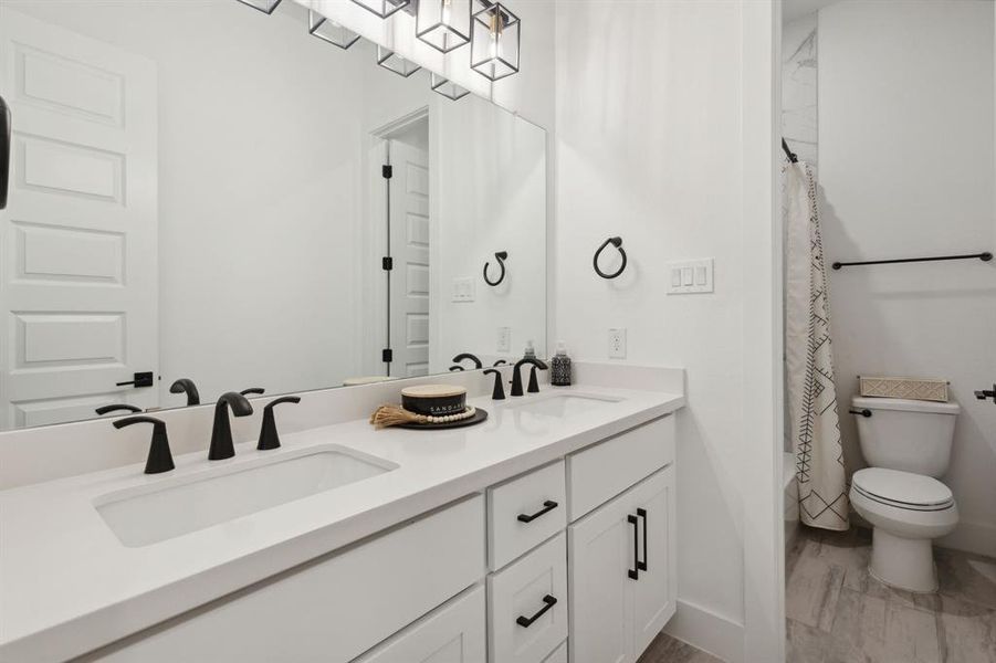 Each full bathroom has a storage vanity with ample room for tucking away extra self-care items and household essentials.