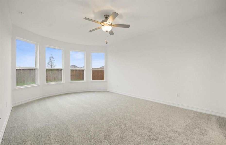 Elegant owner's suite with bay window and private bath*real home pictured