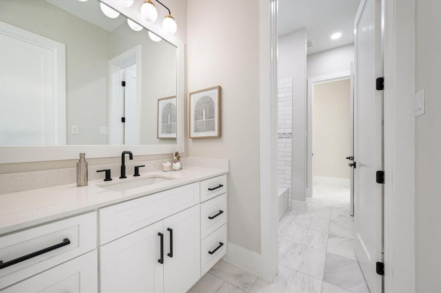 Bathroom featuring vanity and a bathtub