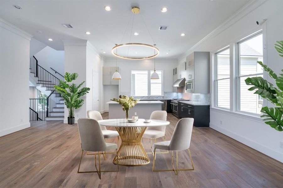 Fine dining area crowned with a stunning circular chandelier.