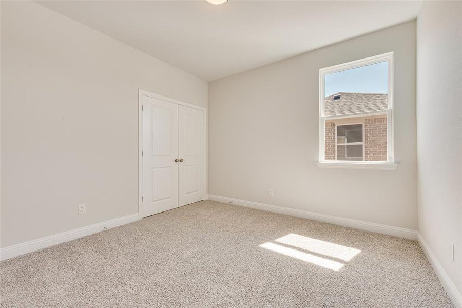 Unfurnished room with carpet floors