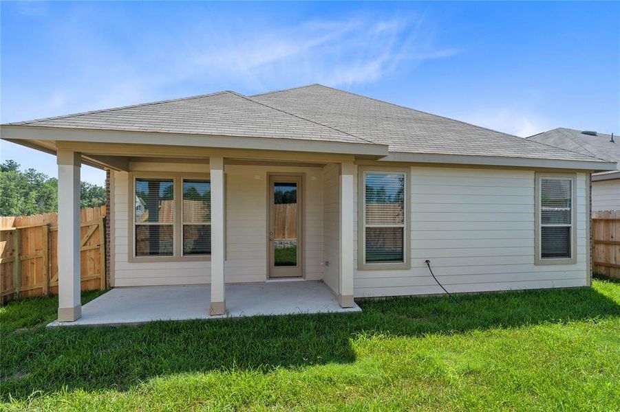 Come and see this spacious backyard with its beautiful covered patio. There is plenty of room for the kids to play and adults to relax!