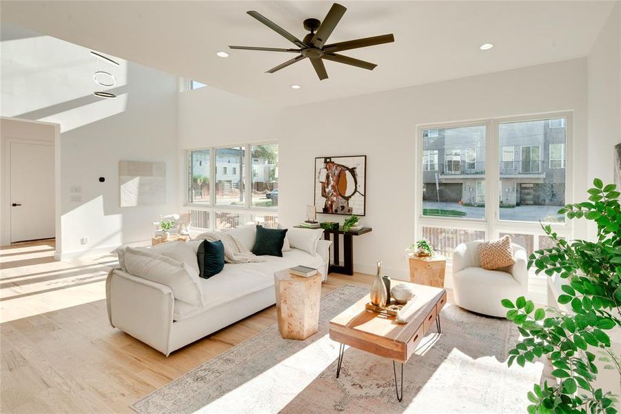 Living room featuring light hardwood / wood-style flooring and ceiling fan