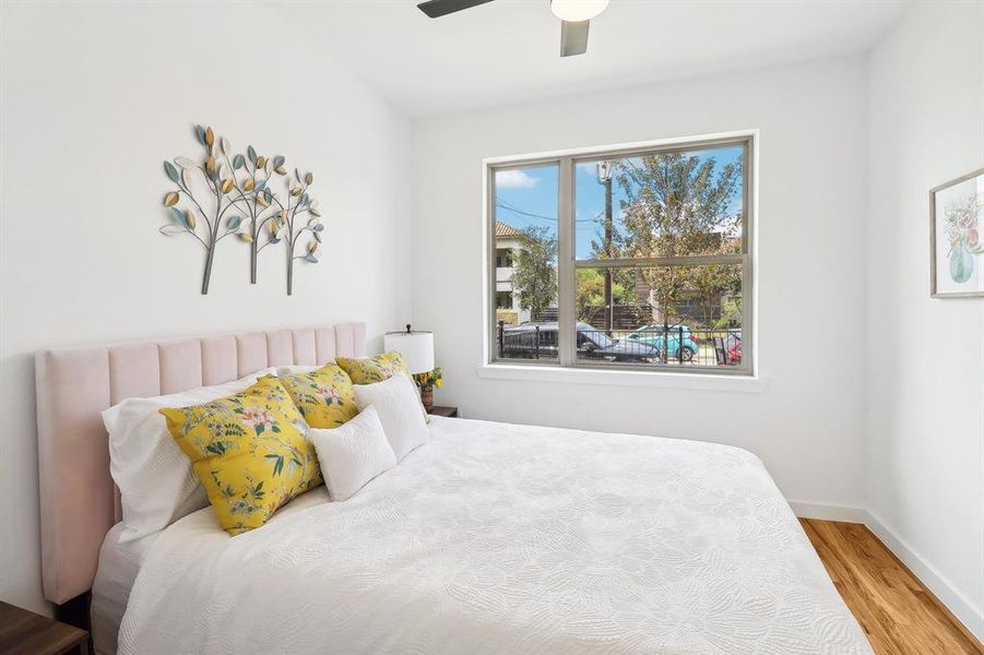 Bedroom featuring ceiling fan and light hardwood / wood-style floors