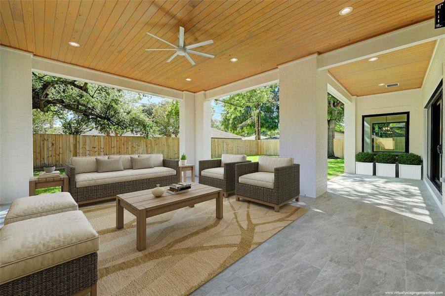 Bring your family's world outside in beauty and comfort. Virtually staged lanai overlooked by breakfast room, shows fully covered access from family room / kitchen.