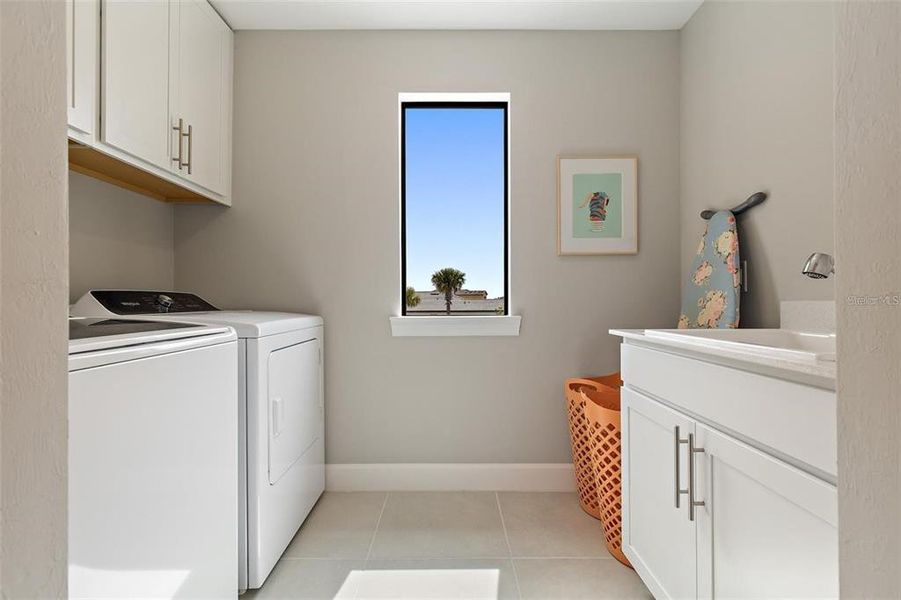 . The laundry room is conveniently located upstairs and it has plenty of space, utility sink and cabinetry for storage.