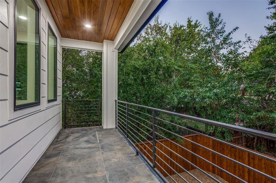 View of backyard balcony at dusk