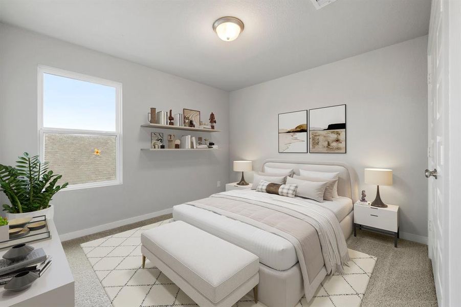 Secondary bedroom features plush carpet, neutral paint, large window and ample closet space.