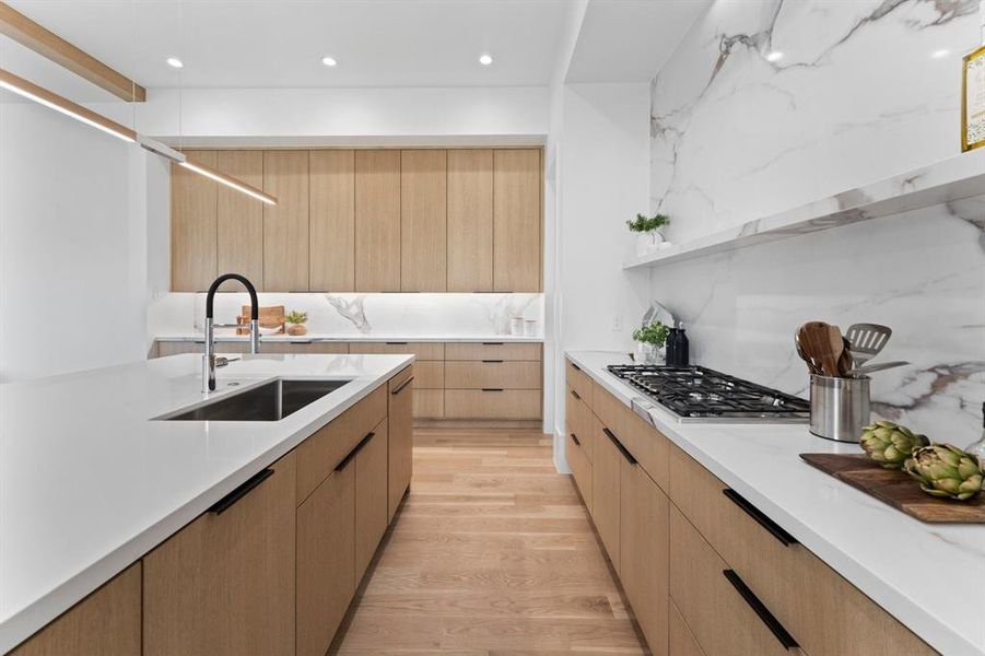 A chef's dream with endless counter and prep space along the stunning Quartz countertops.