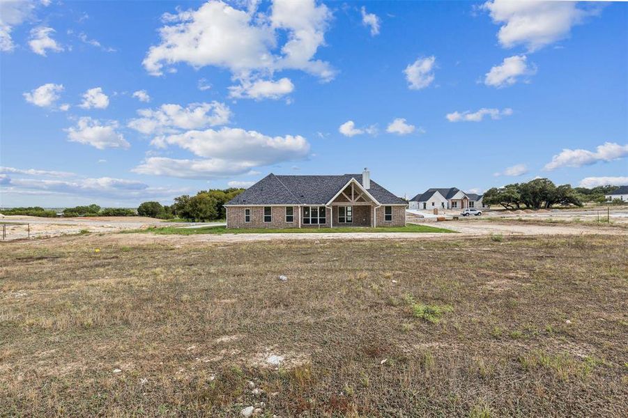 Single story home featuring a rural view