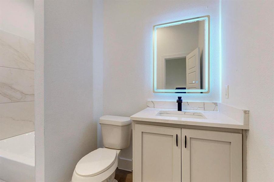 Bathroom with vanity and toilet