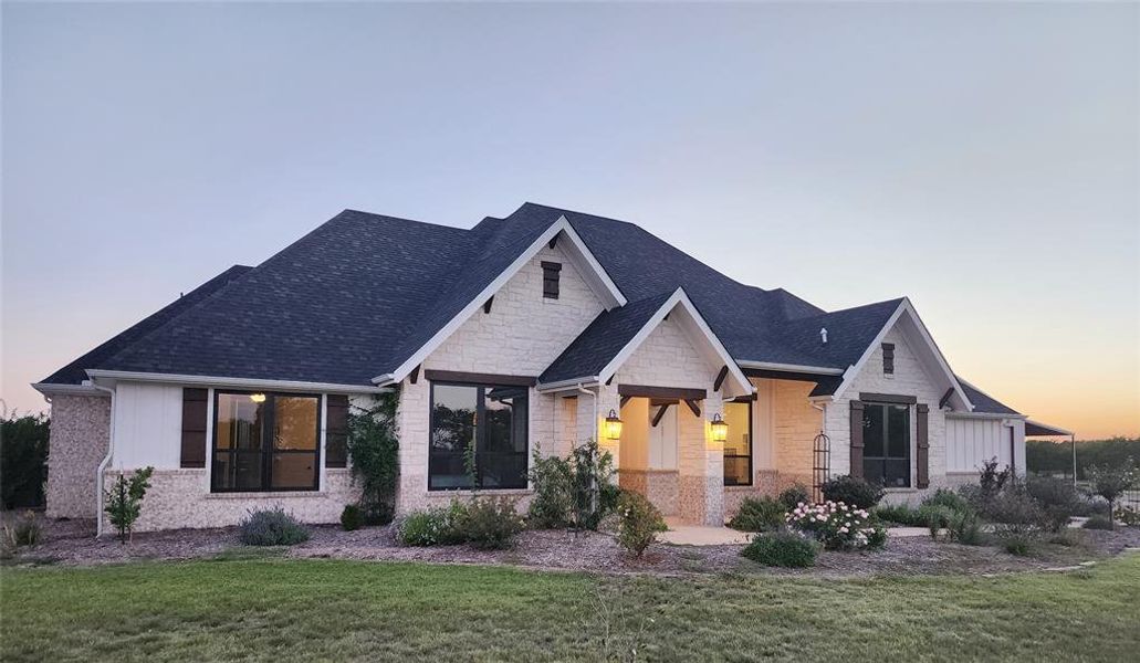 View of front of home with a lawn