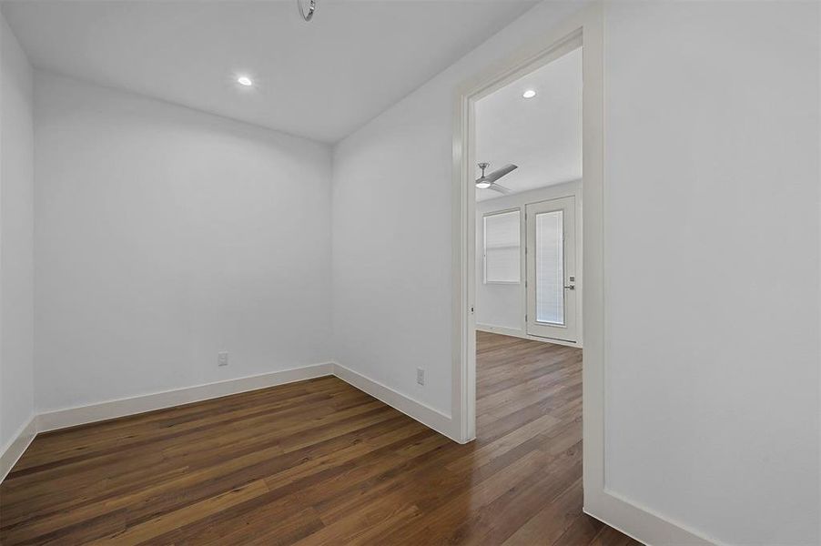 Unfurnished room with dark hardwood / wood-style floors