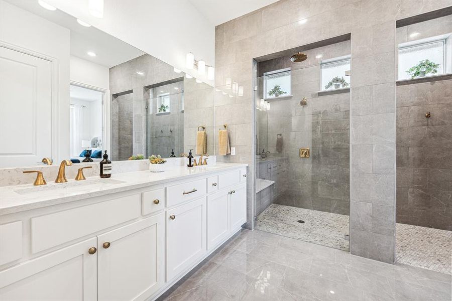 Primary bath with dual vanity and spa quality walk in shower