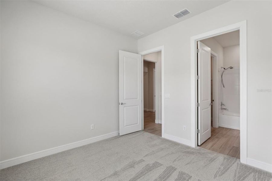 MAIN FLOOR GUEST BEDROOM.