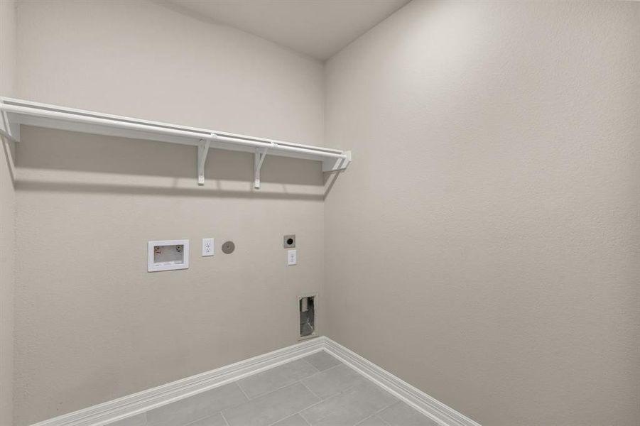 The laundry room layout is carefully planned for optimal workflow with designated areas for washing, drying, and storing.
