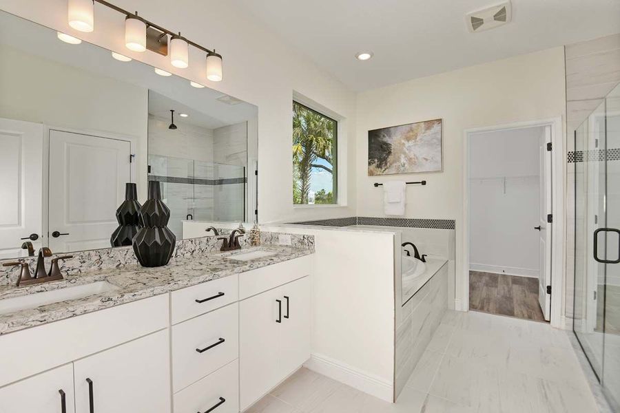 Sandalwood new home first floor owners bath at Tea Olive Terrace by William Ryan Homes Tampa