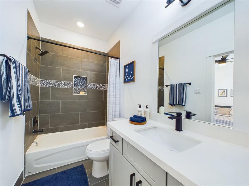 Secondary bathroom! Quartz countertops and shower/tub! Photos from another community by the same builder, FINISHES & COLORS MAY VARY!