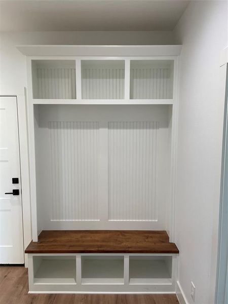 Mudroom featuring wood-type flooring