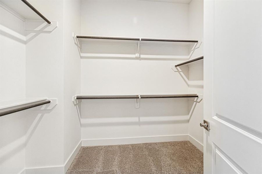Shown here is one o f the twoprimary closets that is spacious andfeatures double rods for plenty ofclothes.
