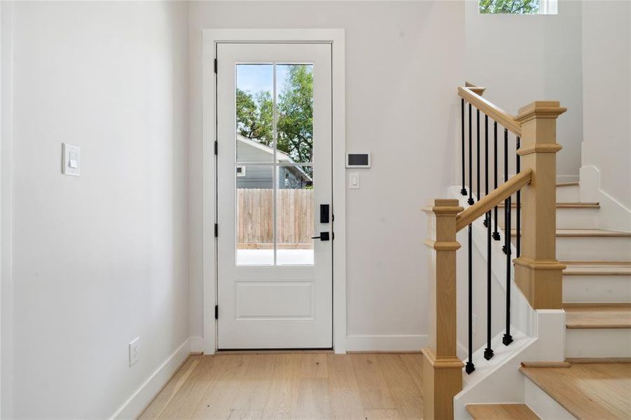 The semi-frameless stand-up shower with a practical niche blends modern functionality with design. Oil-rubbed bronze fixtures and a metal-framed mirror add subtle elegance to the space