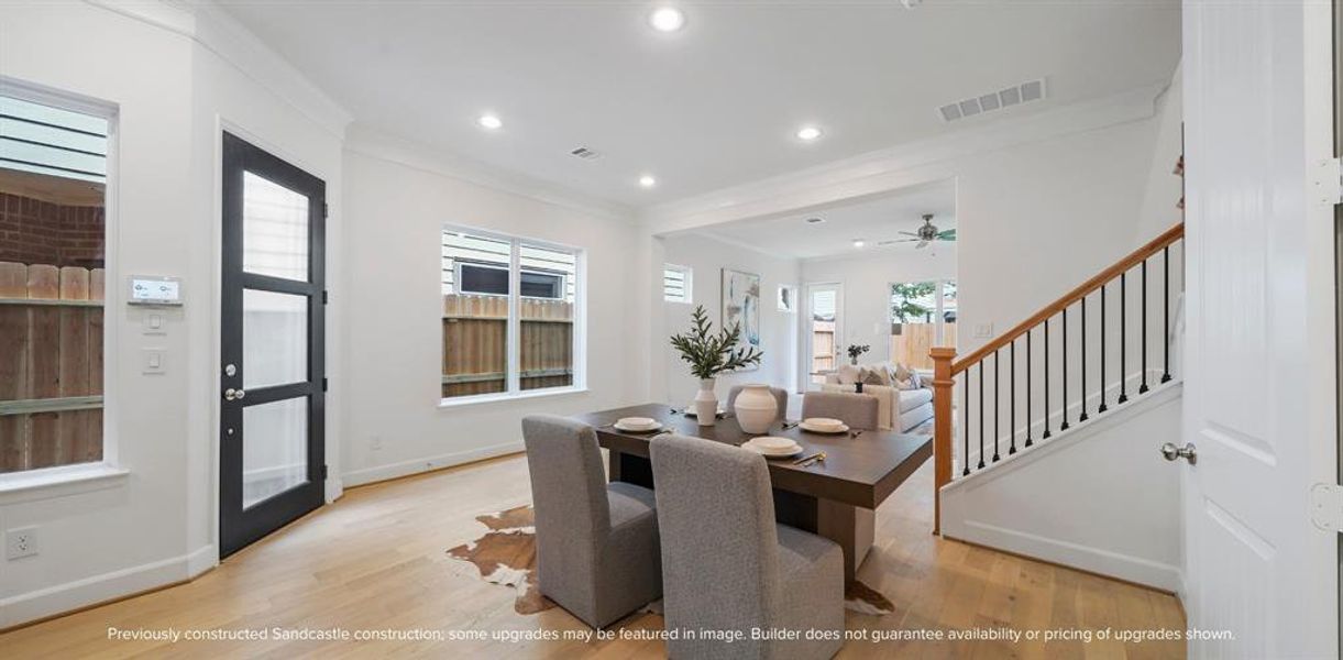 Central Sophistication: Right where family and friends converge, this dining room is the true heart of the home, bathed in welcoming natural light.